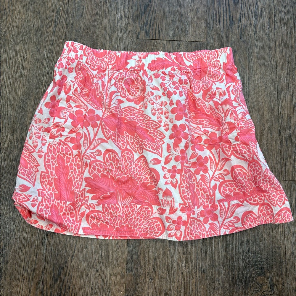 Size small J Crew coral colored floral skirt with pockets.